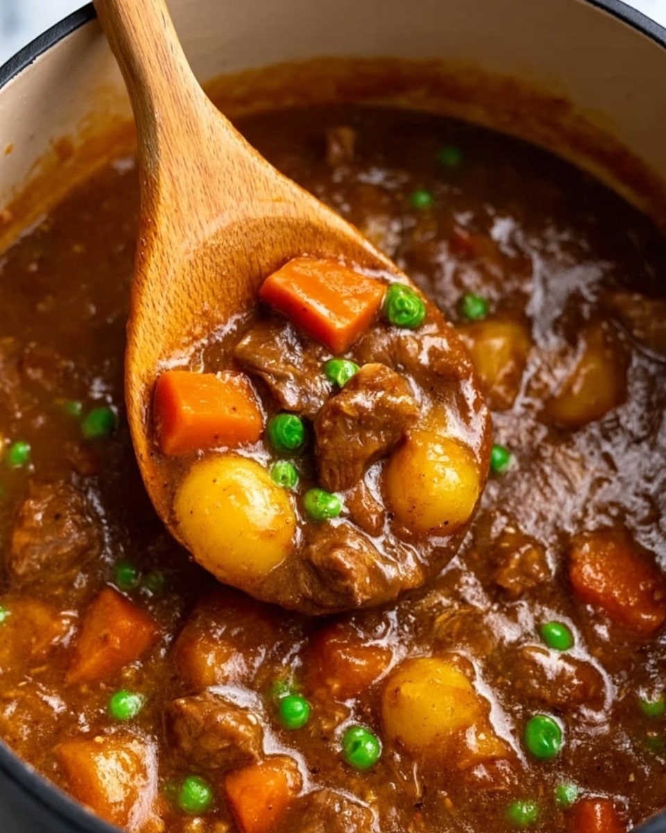 The image shows a close-up of a thick stew with a wooden spoon in it. The stew has a rich brown sauce with chunks of tender meat, bright orange carrot pieces, small round yellow potatoes, and scattered green peas. The spoon is lifting some stew, showing the shiny, smooth texture of the sauce and the mixture of colorful vegetables and meat inside a white pot. The background surface is a white marbled texture. Photo taken with an iphone --ar 4:5 --v 7