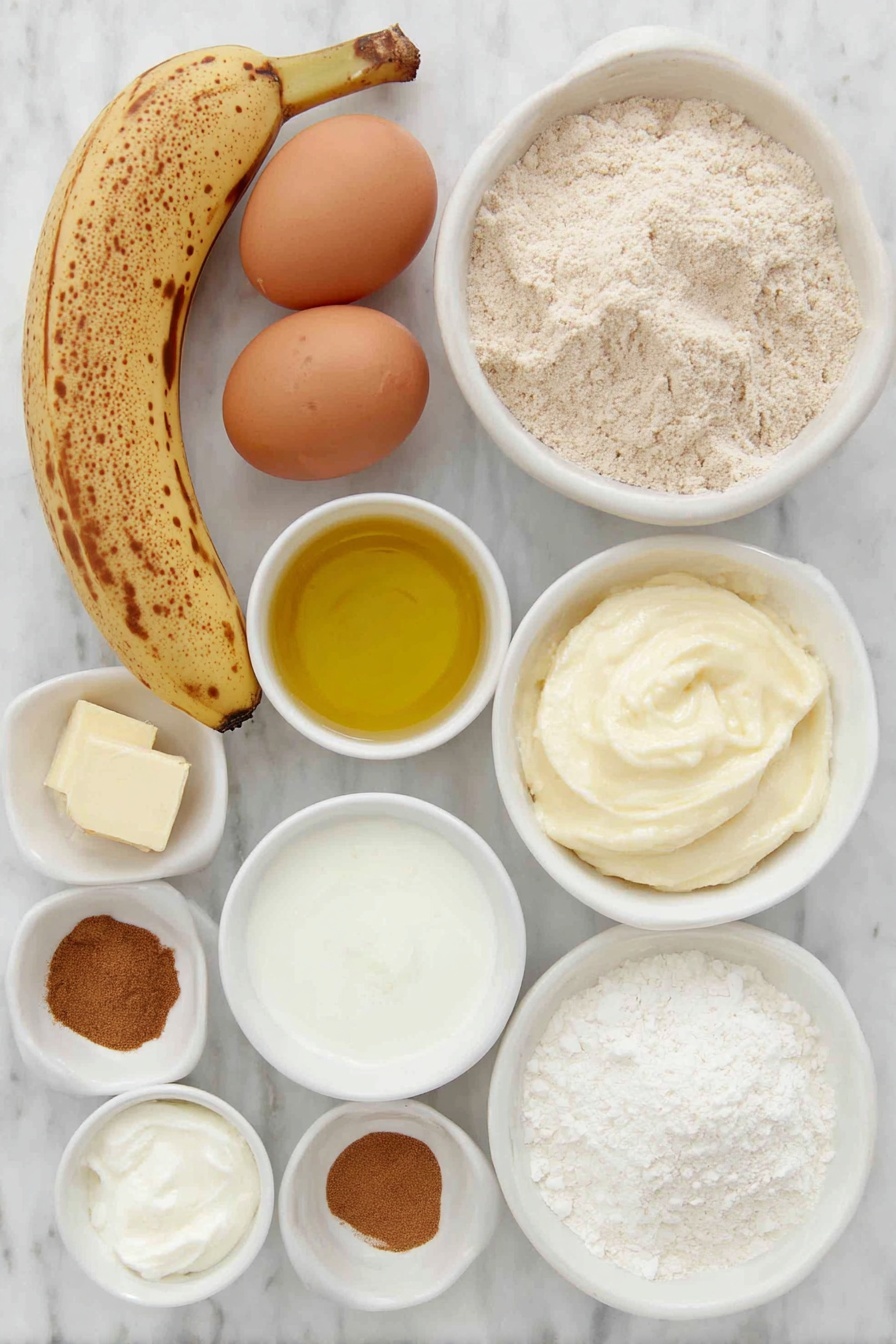 Whole Wheat Banana Bread with Cinnamon Crunch, healthy banana bread, whole wheat banana loaf, cinnamon banana bread, nutritious banana bread - Flat lay of two large brown eggs with clean shells, a small bunch of ripe bananas with brown spots (one peeled showing mashed texture), a small white ceramic bowl of light golden oil, a small white bowl of creamy Greek yogurt, a small white bowl filled with whole wheat flour, a small white bowl of fine white cornstarch, a small white bowl of ground cinnamon powder, a small white bowl of light brown sugar, a small white bowl of soft pale butter, and a small white bowl of fine salt crystals, all ingredients arranged symmetrically in simple white ceramic bowls and plates, placed on a clean white marble surface, soft natural light, photo taken with an iPhone, professional food photography style, fresh ingredients, white ceramic bowls, no bottles, no duplicates, no utensils, no packaging --ar 2:3 --v 7 --p m7354615311229779997