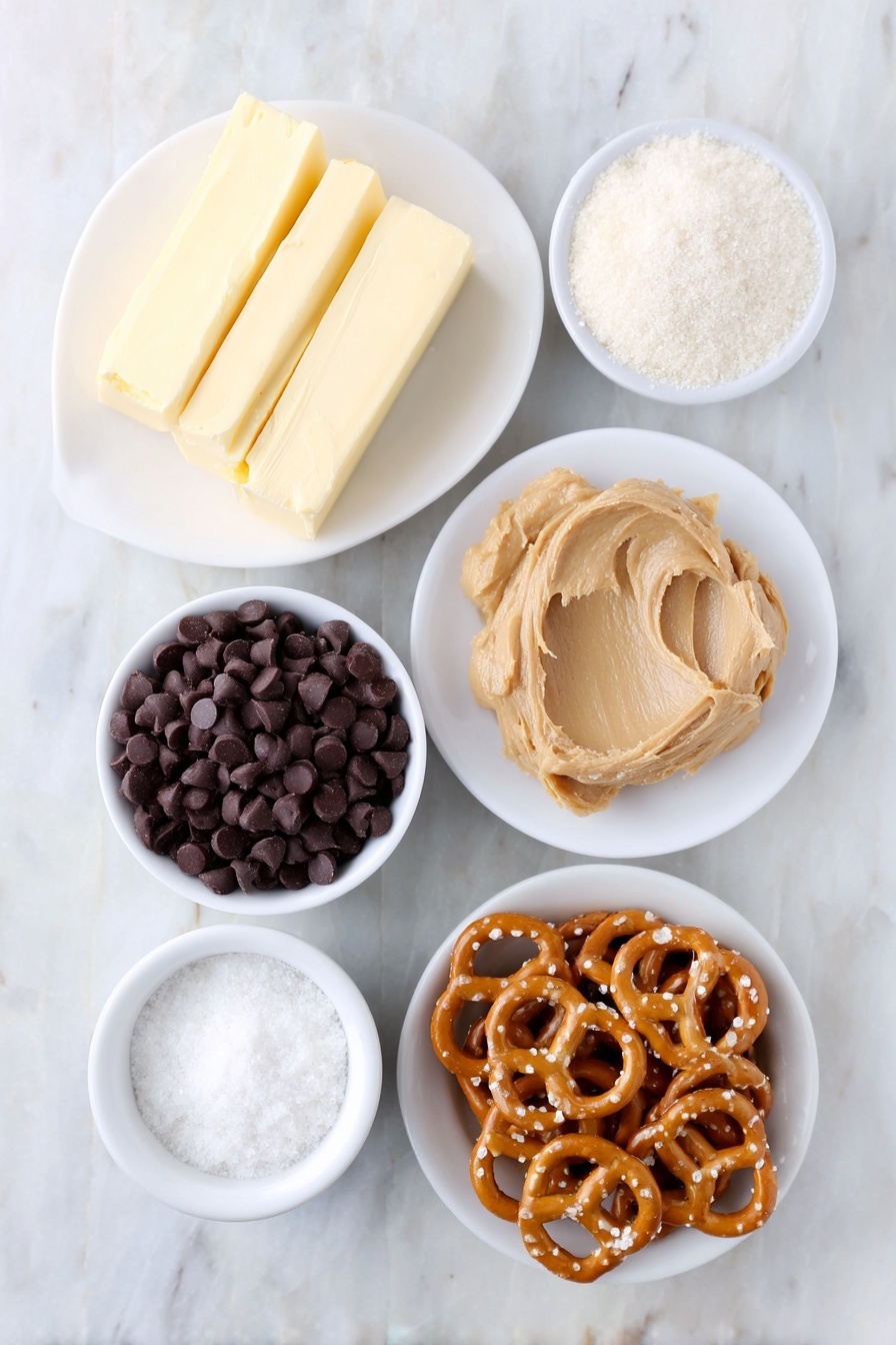 No-Bake Peanut Butter Pretzel Bites, easy no-bake snacks, salty sweet treats, quick dessert ideas, chocolate peanut butter bites - Flat lay of a small mound of creamy peanut butter on a white ceramic plate, a few sticks of salted butter slightly softened on a simple white dish, a small white bowl filled with granulated white sugar, a tiny white bowl holding fine sea salt, a small white bowl of powdered sugar, a neat pile of golden mini twist pretzels arranged next to the bowls, and a small white bowl filled with glossy dark chocolate chips, all placed on a clean white marble surface, soft natural light, photo taken with an iPhone, professional food photography style, fresh ingredients, white ceramic bowls, no bottles, no duplicates, no utensils, no packaging --ar 2:3 --v 7 --p m7354615311229779997