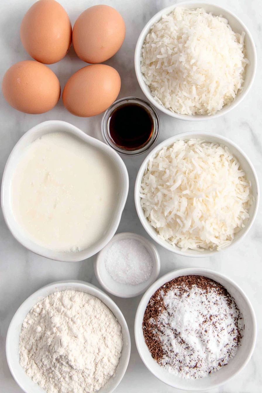 Coconut Milk Snack Cake, tropical snack cake, easy coconut cake recipe, moist coconut cake, simple dessert recipes - Flat lay of a small white ceramic bowl filled with creamy unsweetened coconut milk, a small white ceramic bowl containing melted coconut oil, two whole brown eggs with clean shells, a small white ceramic bowl of granulated sugar, a small white ceramic bowl holding clear vanilla extract, a small white ceramic bowl of all-purpose flour, a small white ceramic bowl with unsweetened shredded coconut, and a small white ceramic bowl with baking powder, all arranged symmetrically and balanced, placed on a clean white marble surface, soft natural light, photo taken with an iPhone, professional food photography style, fresh ingredients, white ceramic bowls, no bottles, no duplicates, no utensils, no packaging --ar 2:3 --v 7 --p m7354615311229779997