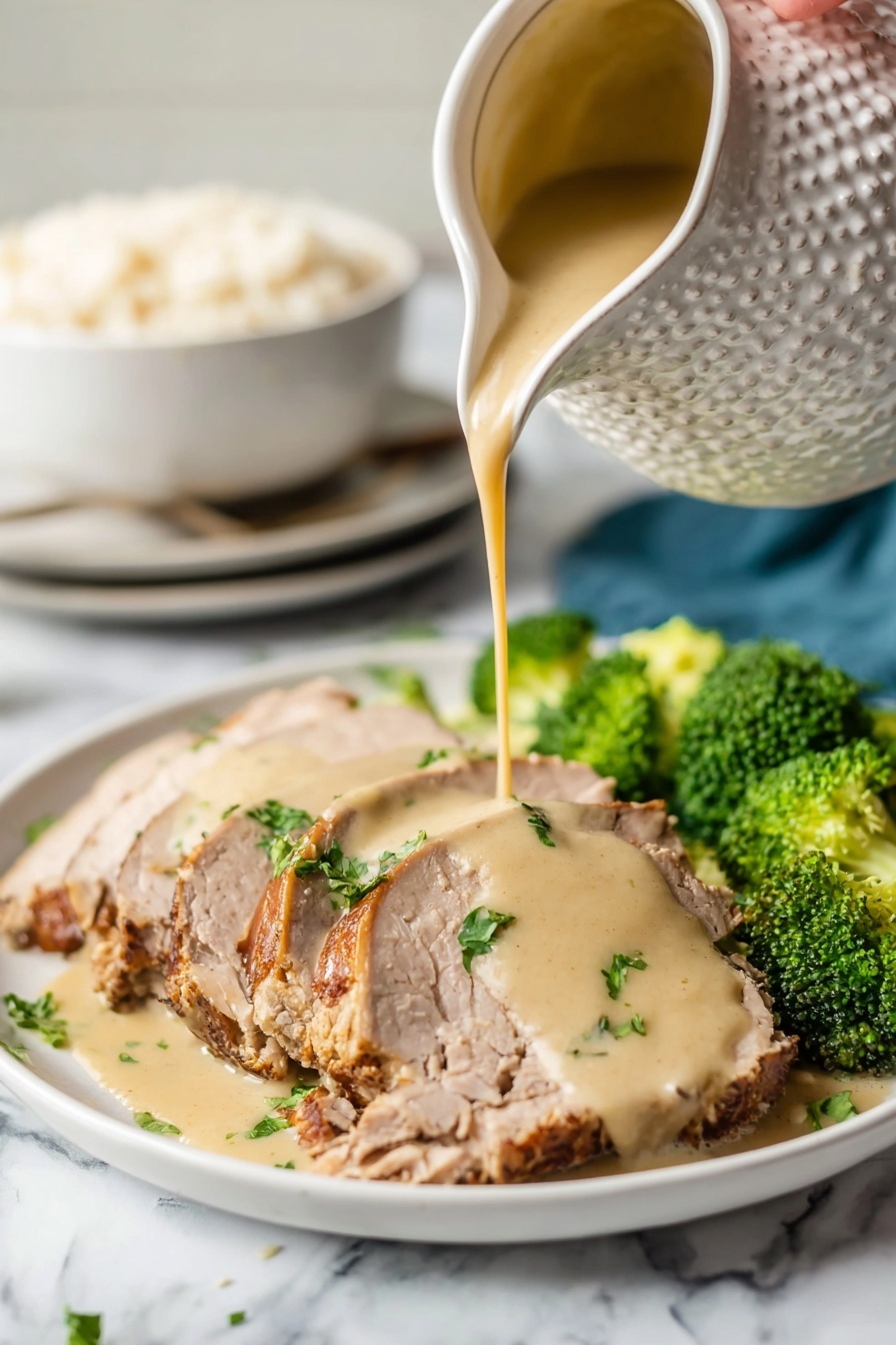 Crock Pot Pork Roast with Easy Gravy, slow cooker pork roast, tender pork recipes, effortless pork dinner, easiest pork gravy recipe - A white plate holds several slices of light brown cooked meat with a slightly darker crust on the edges, arranged in a neat row. A woman's hand pours a thick, creamy beige sauce over the center slices, creating a smooth layer that drapes over the meat. Bright green parsley pieces are scattered on top, adding color contrast. On the side of the plate, vibrant green broccoli florets add freshness to the dish. The scene is set on a white marbled surface, and in the background, a white textured pitcher is seen pouring the sauce, with a white bowl filled with rice and a stack of white plates slightly blurred. photo taken with an iphone --ar 2:3 --v 7