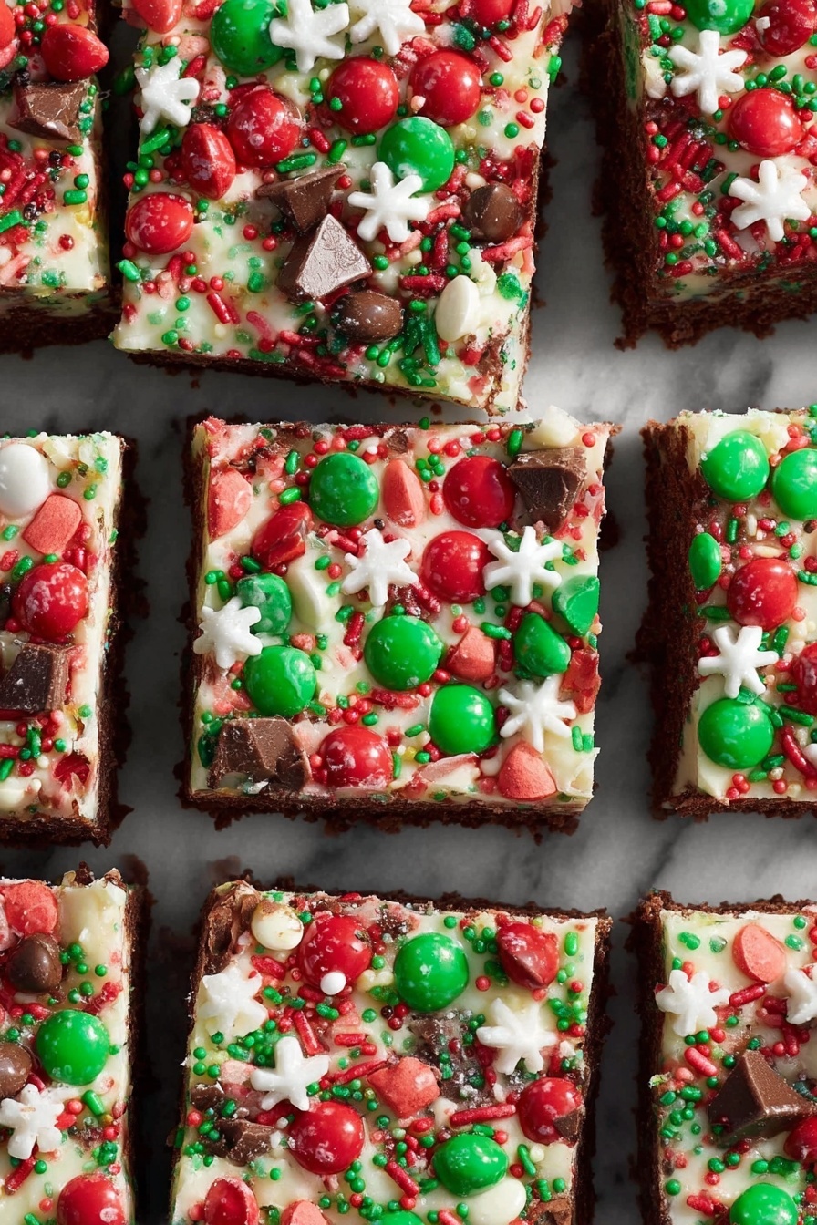 Christmas Brownie Bars with M&Ms, festive brownie dessert, holiday chocolate bars, Christmas treats with M&Ms, easy holiday brownie recipe - This image shows nine square pieces of dessert arranged closely on a white marbled surface. Each piece has three visible layers: a dark brown base layer that looks like a brownie, a thick middle layer of creamy white frosting, and a top layer filled with red and green round candies, chocolate chunks, small white snowflake shapes, and red, green, and white sprinkles scattered evenly. The candies and toppings cover the entire surface of each square, making the top layer colorful and festive. photo taken with an iphone --ar 2:3 --v 7