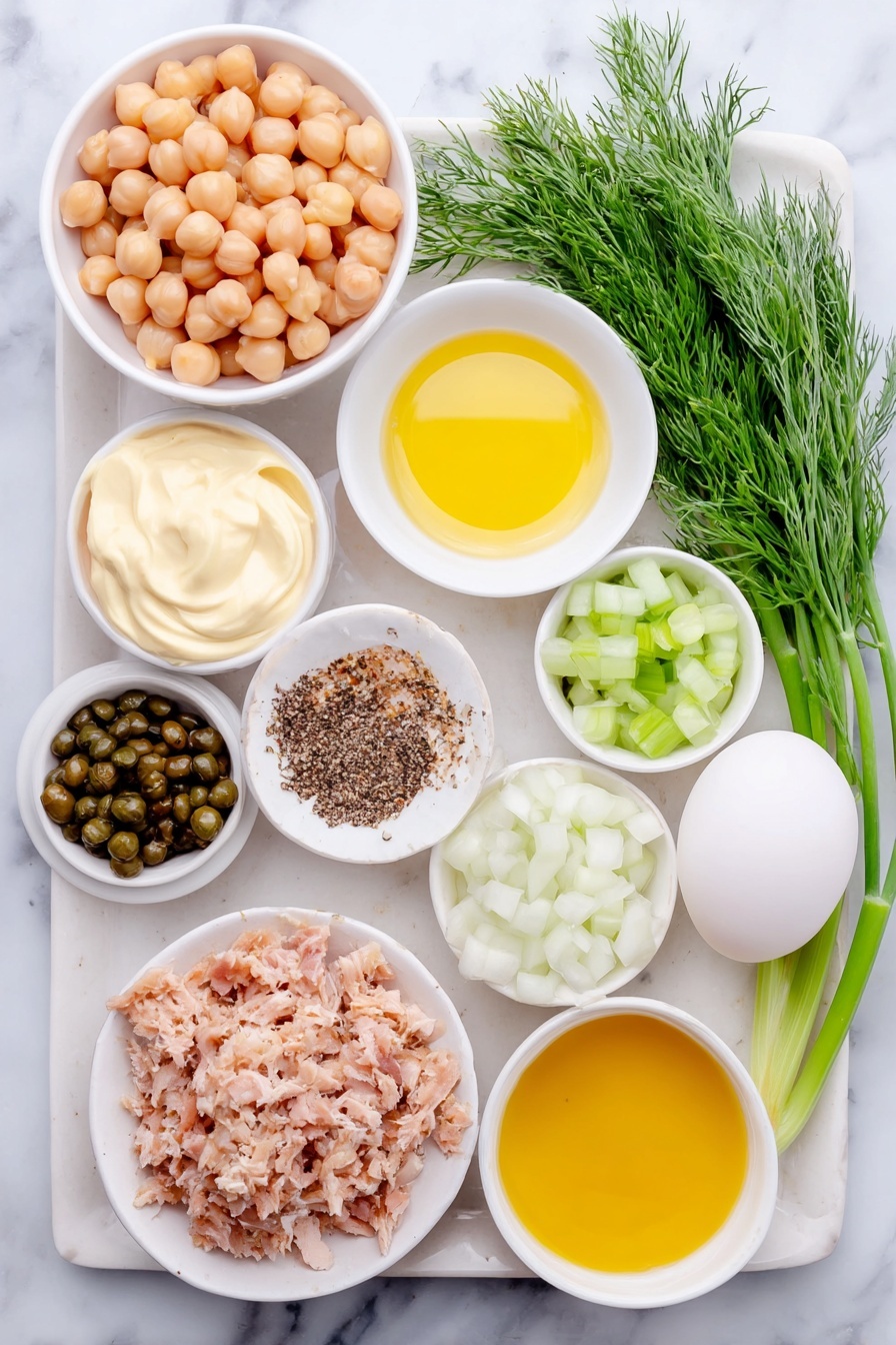 Healthy Tuna Chickpea Salad, Tuna Chickpea Salad, Healthy Salad Recipes, Quick Nutritious Meals, Protein-Packed Salads - Flat lay of a small pile of shiny light beige chickpeas, a simple white ceramic bowl with creamy mayonnaise, a small white bowl of golden olive oil, a small white bowl with bright yellow fresh lemon juice, a small white bowl holding smooth dijon mustard, a few fresh green dill sprigs, a small heap of finely chopped pale green celery, a small amount of finely minced bright purple-red onion, a small mound of briny green capers, a small flaky pile of light pink tuna, a small white bowl with ground black pepper, and a whole clean white egg with uncracked shell, all arranged in perfect symmetry on a clean white ceramic plate and bowls, placed on a clean white marble surface, soft natural light, photo taken with an iPhone, professional food photography style, fresh ingredients, white ceramic bowls, no bottles, no duplicates, no utensils, no packaging --ar 2:3 --v 7 --p m7354615311229779997