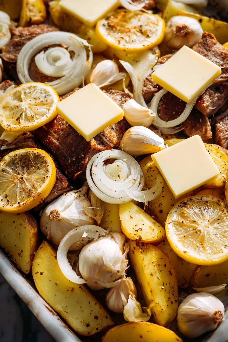 Greek Garlic Butter Chicken and Potatoes, Greek chicken sheet pan meal, garlic butter chicken and potatoes, easy Greek chicken dinner, Mediterranean roasted chicken - The image shows a close-up of a cooked dish with several layers. The bottom layer is pieces of brown roasted meat, and around it are yellow potato wedges with black pepper. On top of the meat and potatoes are thin white onion slices spread evenly. There are slices of bright yellow lemon placed in different spots, along with some whole garlic bulbs. Over the top are several square slices of pale yellow cheese, resting on the lemon slices and meat. The dish sits on a white marbled surface, and the lighting makes the food look warm and tasty. photo taken with an iphone --ar 2:3 --v 7