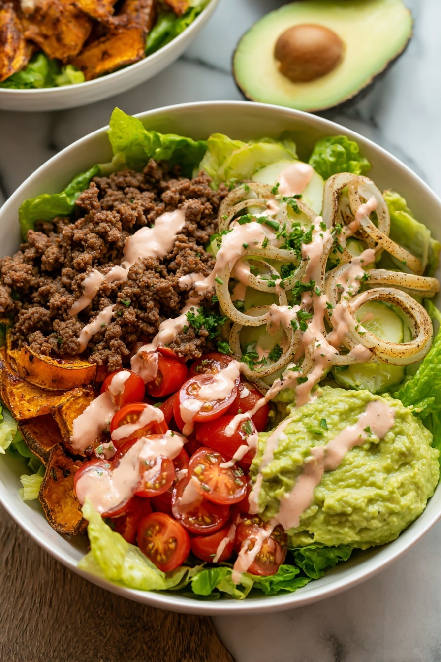 Loaded Burger Bowl with Special Sauce, burger bowl recipe, easy burger bowl, healthy burger bowl ideas, savory burger bowl dinner - The image shows a white bowl filled with a fresh salad arranged in layers. At the bottom, there is a base of green lettuce leaves. On top of the lettuce, there are several layers including bright red cherry tomato halves, crumbled cooked ground beef in brown color, and slices of pale green pickles sprinkled with chopped herbs. There are also thin slices of cooked meat with a golden-brown crispy texture and lightly grilled onion rings with a slightly translucent look. On one side of the bowl, there is a generous scoop of green guacamole, and pinkish creamy dressing is drizzled over the top of all the ingredients. The bowl sits on a white marbled surface, with halves of fresh avocado in the background. Photo taken with an iphone --ar 2:3 --v 7