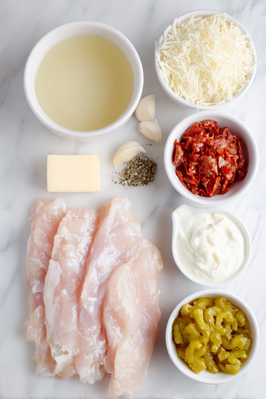 Creamy Pepperoncini Chicken Skillet, pepperoncini chicken, easy weeknight chicken recipe, one-pan chicken dinner, flavorful chicken skillet - Flat lay of fresh raw chicken strips, a small pat of butter, a whole white onion diced beside it, a few garlic cloves diced, a small white bowl of pale golden chicken stock, a small white bowl of sliced roasted red peppers, a small white bowl of heavy cream, a small pile of shredded parmesan cheese, a small white bowl of Italian seasoning herbs, a small white bowl filled with bright yellow-green whole pepperoncini peppers, all arranged with perfect symmetry on a clean white marble surface, soft natural light, photo taken with an iPhone, professional food photography style, fresh ingredients, white ceramic bowls, no bottles, no duplicates, no utensils, no packaging --ar 2:3 --v 7 --p m7354615311229779997
